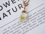 Handmade Resin Mustard Seed White Flower Necklace - Image 2