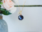 Handmade Galaxy Planet Resin Necklace with Gold Sun Charm - Image 2
