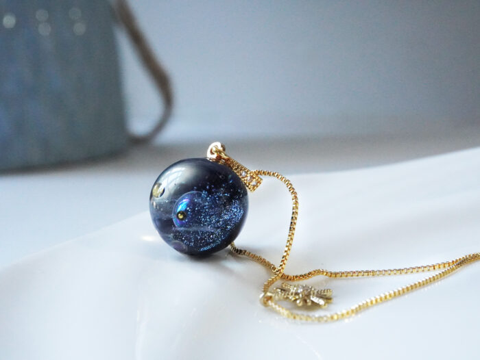 Handmade Galaxy Planet Resin Necklace with Gold Sun Charm - Image 4