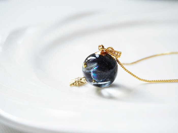 Handmade Galaxy Planet Resin Necklace with Gold Sun Charm - Image 5