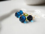 Lunoriah Studio handmade blueberry resin earrings with gold ear wires and floral charm